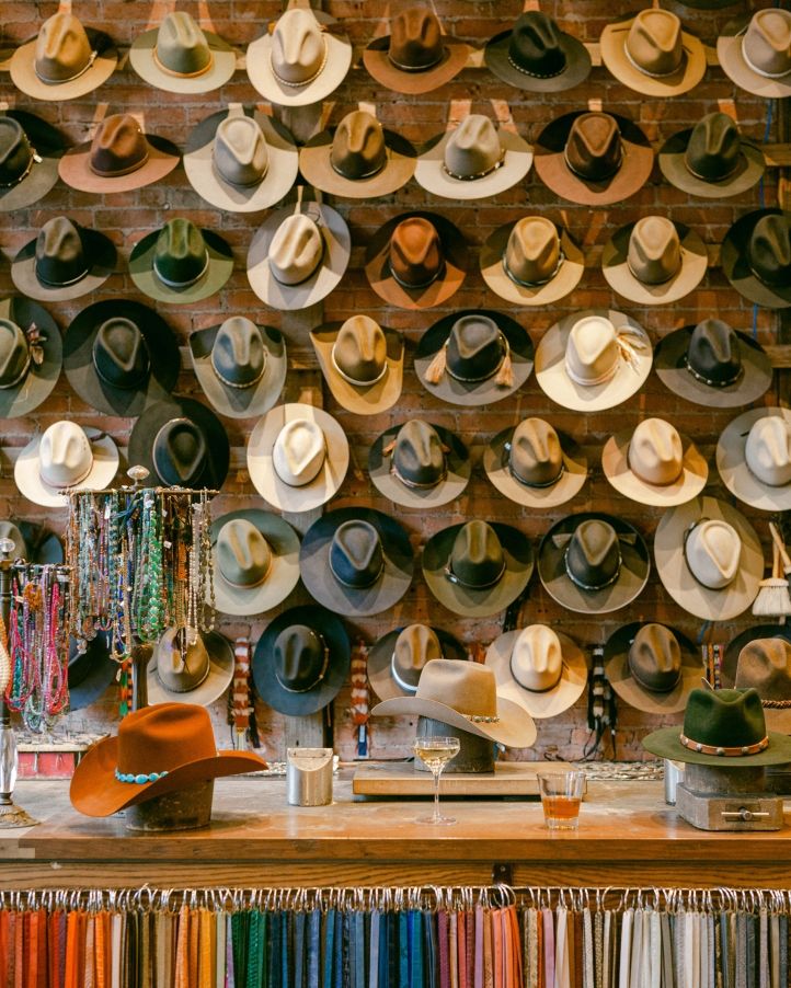 A wall of custom felt hats at Kemo Sabe in Aspen